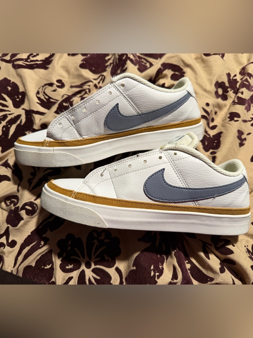Nike Kids White Leather Sneakers with Gray Swoosh and Gold Accent